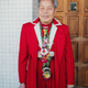 You Tian Wu, 83, with a bolo tie he made from Mardi Gras beads.